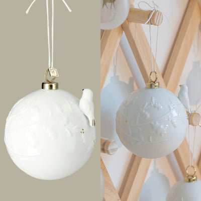 Räder Winterkugel Vogel